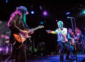 Bassist Mick Conroy gets the handoff from Robbie Grey during Modern English performance at the Echoplex - Photo © 2016 Donna Balancia