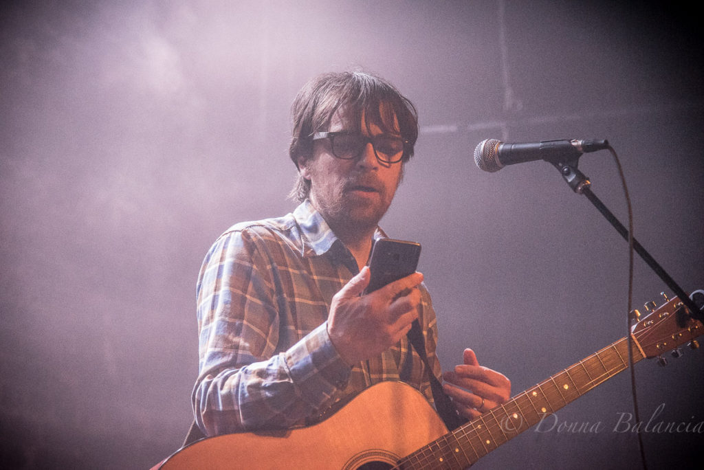 Rivers Cuomo checks his messages during performance at the Hi Hat - Photo © 2018 Donna Balancia