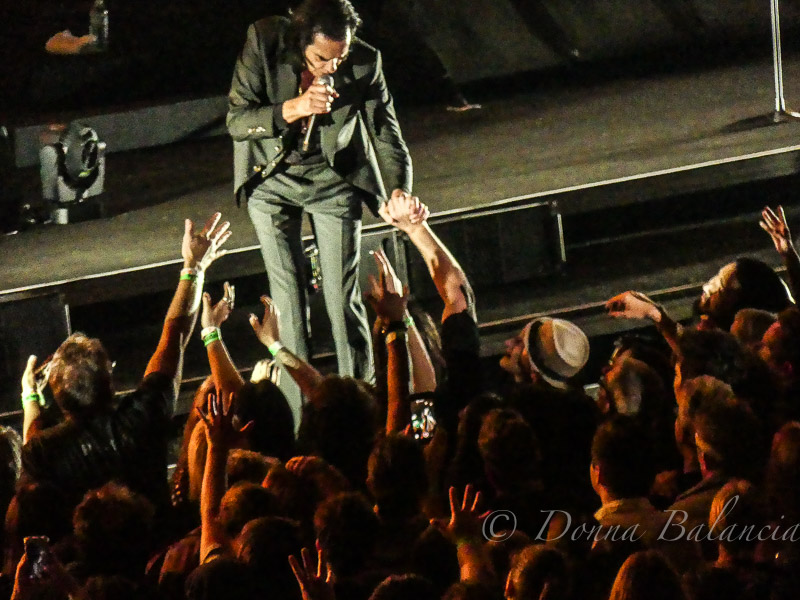 Nick Cave holds hands with fans - Photo © 2018 Donna Balancia