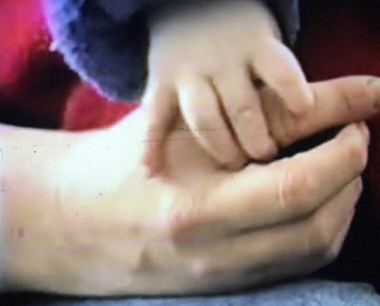 LiL Peep's hand as a baby with mom - Courtesy