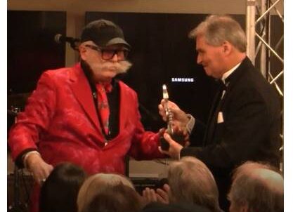 Kevin O'Callaghan accepts his induction award from Larry 'The Duck' Dunn - Photo courtesy of LIMEHOF